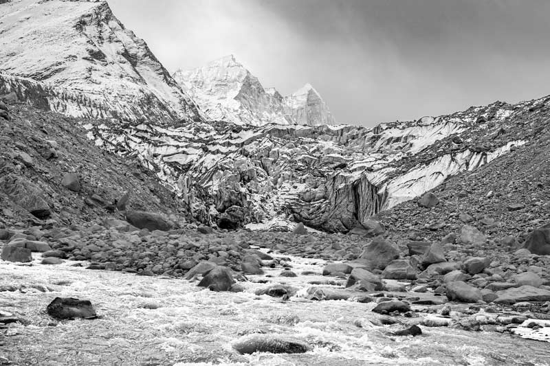The Gangotri glacier and the Bhagirathi river flowing out from its snout in Uttarkashi district, Uttarakhand
